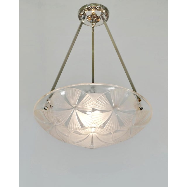 Francis Hubens & Degué A nickel-plated bronze or solid brass French art deco pendant by Francis Hubens made around...