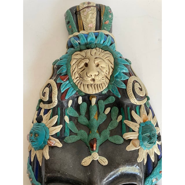 Here is a stunning vintage Mexican folk art wall mask crafted almost entirely of hand-formed pottery, including the dark...