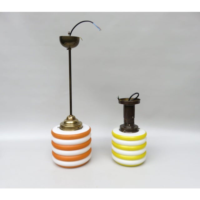 The lamps vary in size, color, and design, but can be used very effectively as an unlikely pair, as the glass shades are...