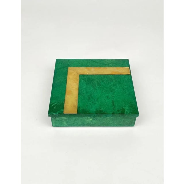 Squared box in green goatskin with brass details attributed to the Italian designer Aldo Tura. Made in Italy in the 1960s....