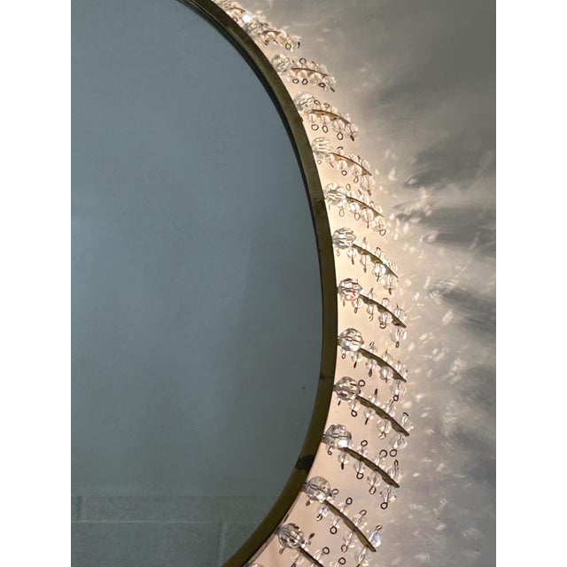 This backlit mirror is attributed to the German manufacturer Palwa