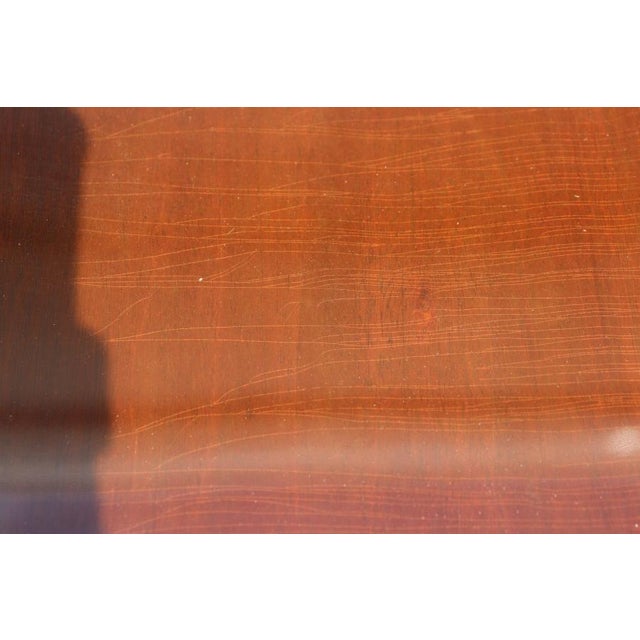 This magnificent antique mahogany extendable dining table is a beautiful example of traditional craftsmanship, timeless...