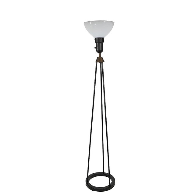 Classic Mid Century tripod floor lamp featuring three radiating rods, which are supported by a circular ring form base,...