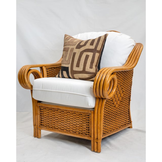 A pair of Vintage Rattan Indoor/Outdoor Chairs, New Cushions. Beautiful pieces.