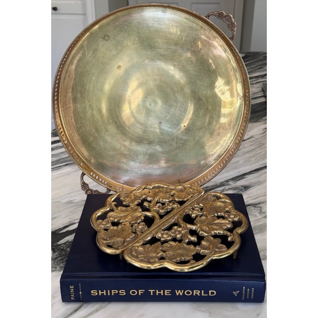 Made in Baltimore, Maryland., U.S.A. here is a pair of vintage solid brass, substantial weight trivets. In a leaves and...