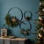 Elevate your space with the sleek elegance of the Iron Metal Rings Wall Display Set. Featuring three distinct sizes (12"D,...