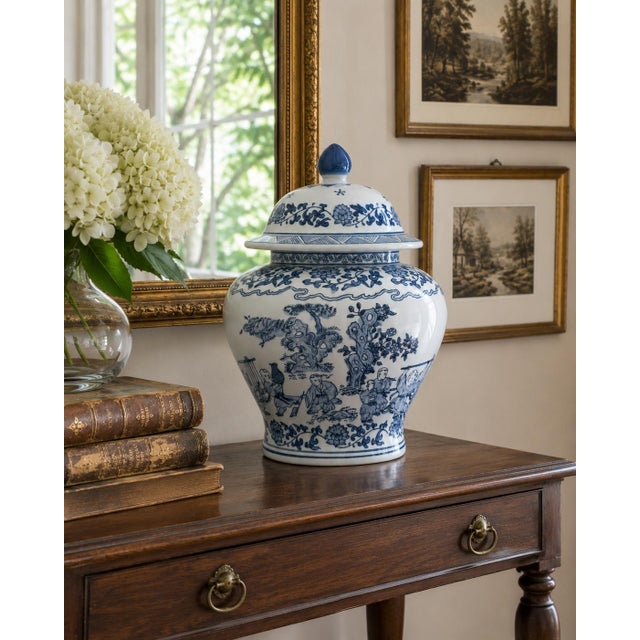 A classic blue and white ginger jar, decorated throughout with delicate Chinese landscapes and floral motifs. The pattern...