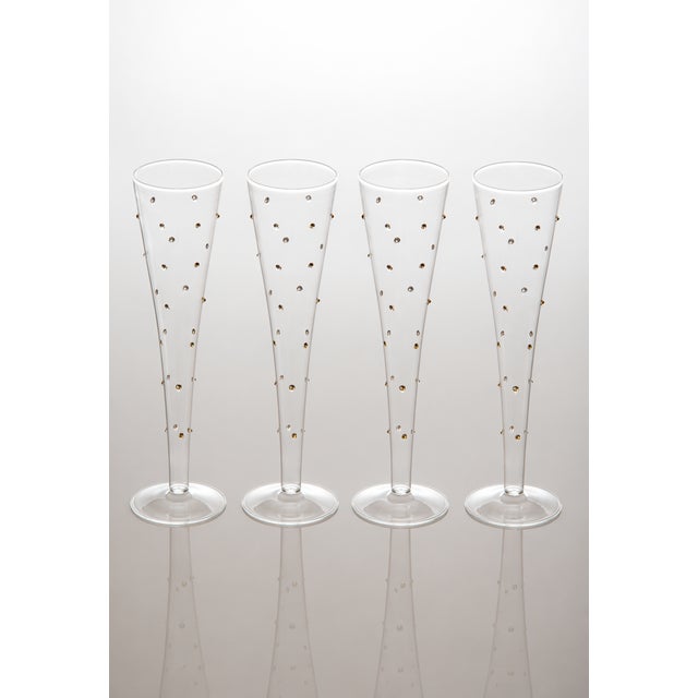 Recreate your own glamour night by serving champagne in this simple yet elegant flute. The tiny gold dots make the...