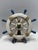 Bring relaxed coastal charm to your space with this decorative nautical ship’s wheel wall hanging. Finished in distressed...