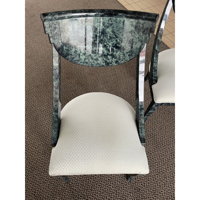 This pair of Pietro Constantini dining side chairs with a lacquered, high-gloss, faux-malachite finish will make a...