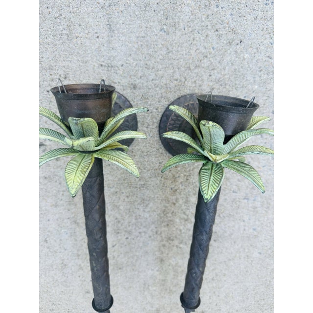 This is a charming pair of wall-mounted candle holders with the following details: • Design: The holders are styled to...