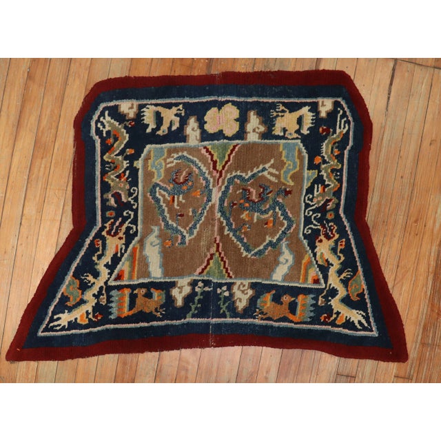 An early 20th century Tibetan dragon-horse cover textile rug,