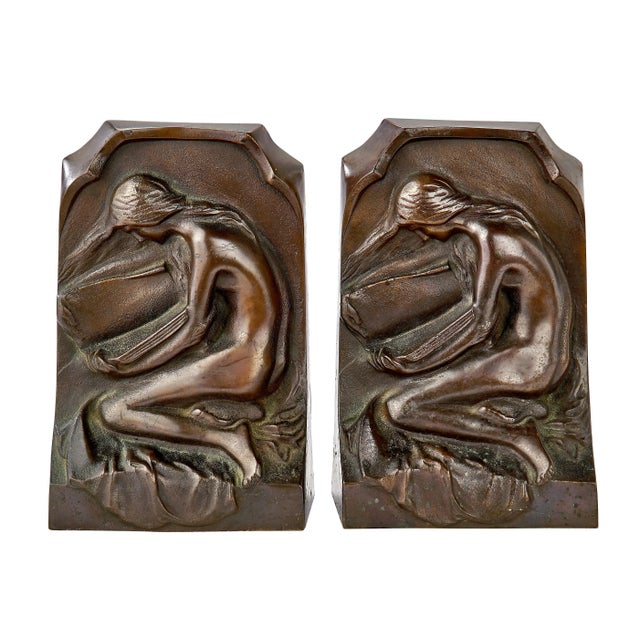 Amazingly sculpted female figure on the heavy bronze bookends. The female figure appears to be looking through the pages...