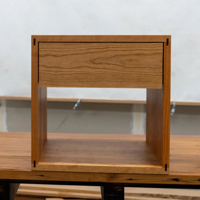 This nightstand comes with the timeless beauty of natural cherry wood with its minimalist nightstand design. Meticulously...