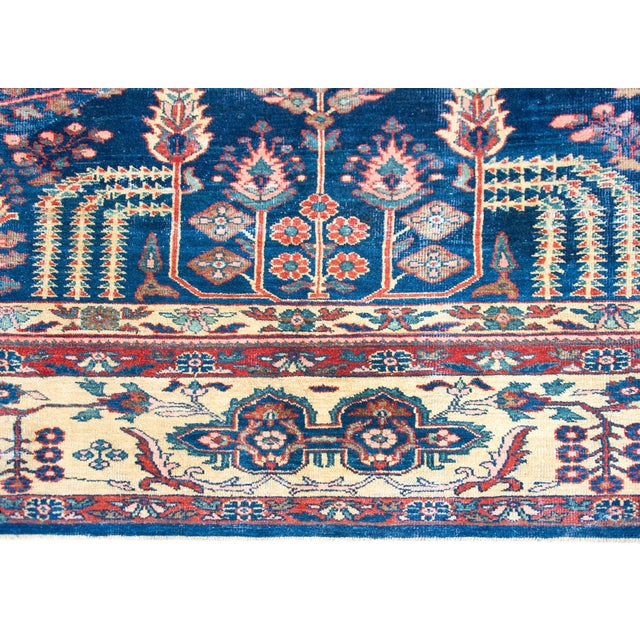 A breathtaking early 20th century Persian Sultanabad rug with a tree-of-life pattern containing a large central tree...