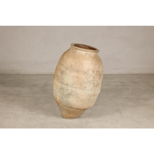 This antique Japanese Shigaraki ware grain storage jar embodies the quiet beauty and rustic character for which the...