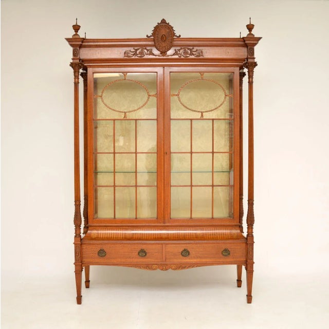 A magnificent and very rare antique Victorian satinwood display cabinet, beautifully made from inlaid satinwood. This was...