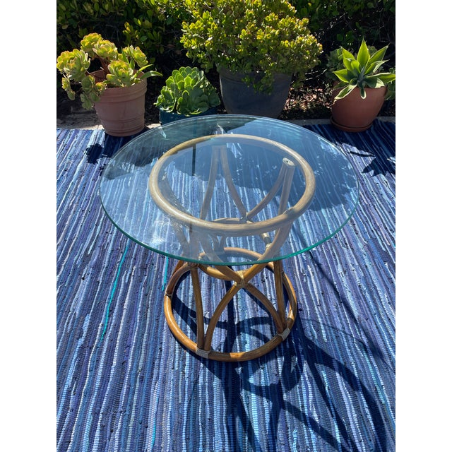 Offering an awesome little vintage side table by luxury brand McGuire of San Francisco. Featuring a pedestal style base in...