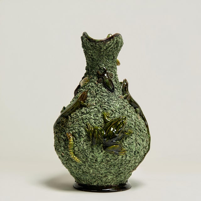 Standout 19th Century majolica palissy pitcher crafted in terracotta in an eccentric composition with hand decorated...