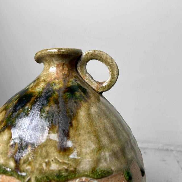 Very beautiful Japanese ceramic Shigaraki jug in stunning earth tones. The top is finished with a natural moss green drip...