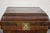 A Qing Dynasty period hinged wooden box from the 19th century with brass hardware and nicely weathered patina. Crafted...
