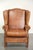 This lovely and comfortable English-style wing armchair is made of sheepskin and has a beautiful light cognac color. It...
