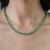 The Regal Green Onyx Necklace and Ruby Stud Earrings Jewelry Suite brings together rich green hues and vibrant ruby-red...