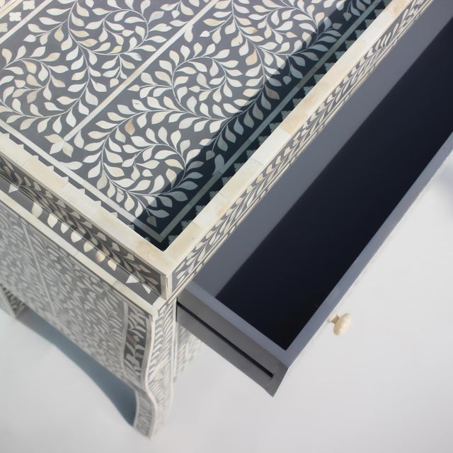 The French Bombay Style Floral Bone Inlay Changing Table reimagines traditional nursery furniture through the elegance of...