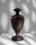 Unveil the grandeur of the 1900s with this authentic French cast iron urn, a classic decorative element to enchant any...