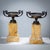Pair of bronze tazzas in a neoclassical style, intricately crafted and mounted on square bases made of exquisite Siena...