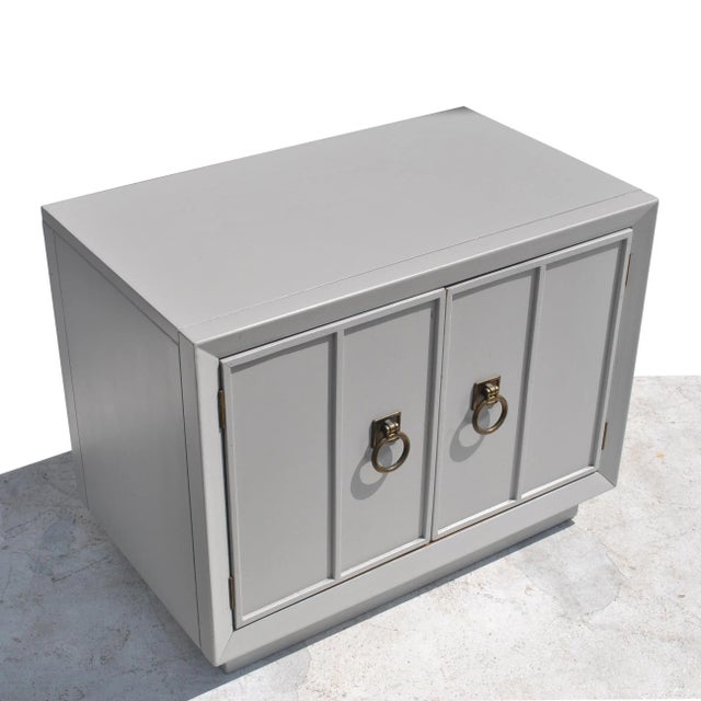 Pair of Mid-Century Modern nightstands Regency style side tables Restored in a dove grey with brass pulls. Ample storage...