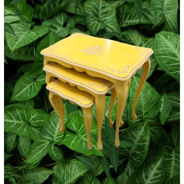 A great set of yellow vintage French nesting tables, made of very light wood easy to move around when needed. Totally...