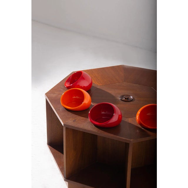 Immerse yourself in the artistry and innovative design of the mid-20th century with this exquisite coffee bar table...