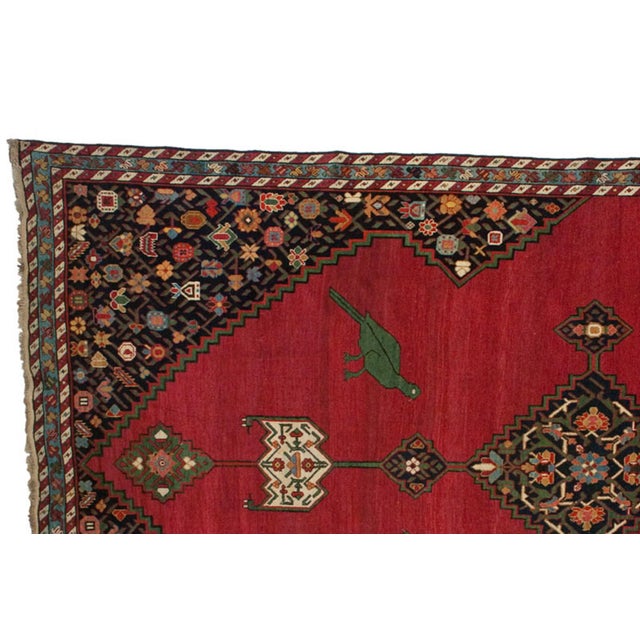 :: Single column of center medallions with larger main medallion, atop an open field with male and female birds facing...