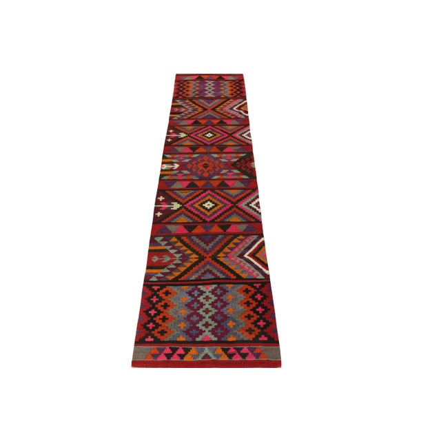 Dextrously woven in wool circa 1950-1960, this 1950s vintage runner piece hails from Rug & Kilim’s coveted Kilim & Flat...