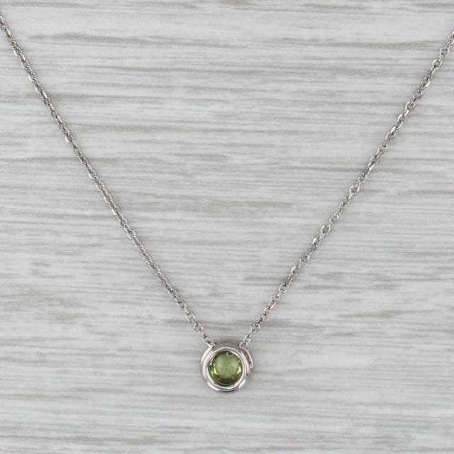 Gemstone Information: - Natural Peridot - Carats - 0.30ct Cut - Round Brilliant Color - Light Green - Natural Diamonds-...