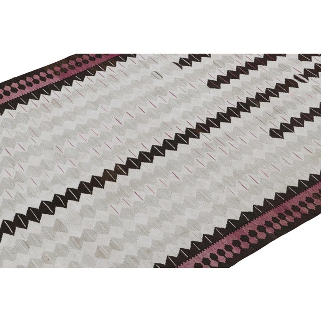 This vintage 6x10 Persian kilim is a rare mid-century Shahsavan rug, believed to originate from the city of Qazvin. On the...