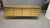 This sideboard is crafted entirely of brass, featuring a one-of-a-kind front composed of 120 authentic Murano glass...