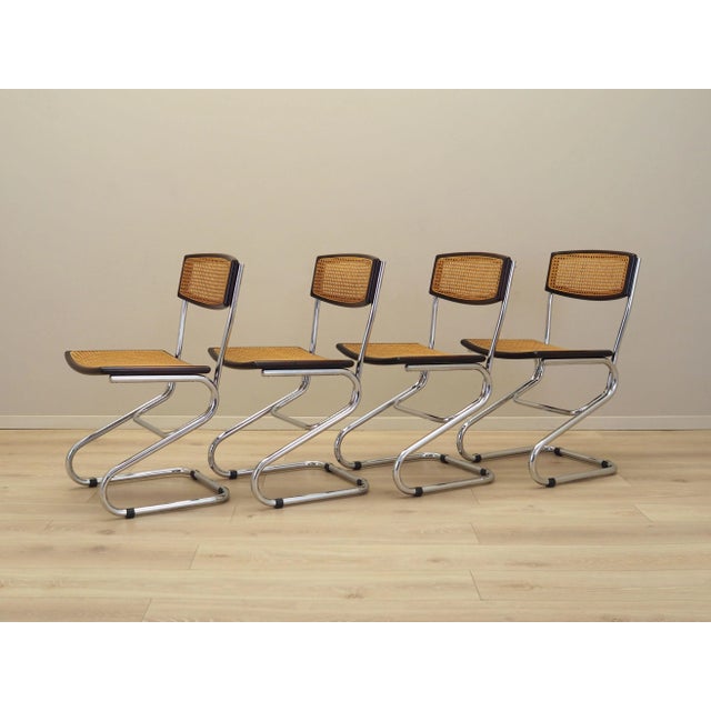 The set of four chairs was made in the 1960s, Italian production. Bauhaus style chairs. The frame is made of metal. The...