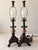 Elegant vintage pair of table lamps featuring highly ornate sculptural bases with flowing leaf and scroll motifs. Each...