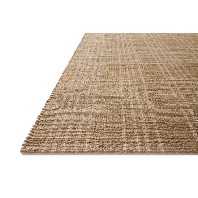 The Judy Collection from Chris Loves Julia x Loloi is a handwoven area rug made with natural fibers for an easygoing yet...