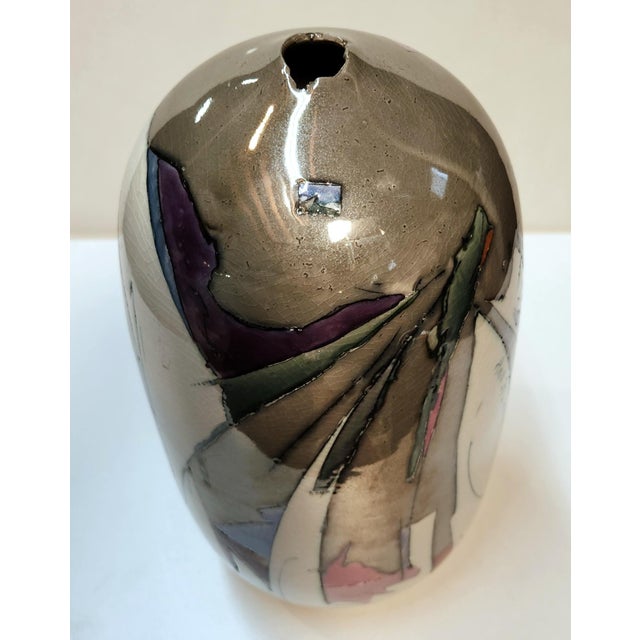 Ceramic piece by artist Kirk Freeman Porcelain with inlaid slip drawings, clear glaze, multiple fired color clusters....