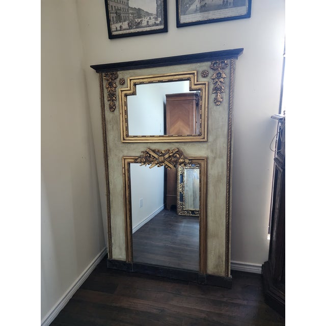 Charming pale green and gold mirror.