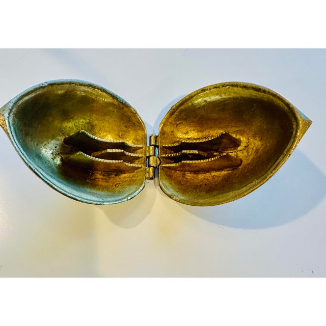 A brass walnut shaped nutcracker that really does work. These were mainly made in the 1970’s.