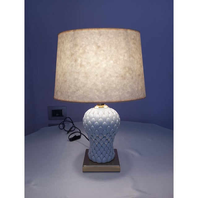 Vintage table lamp attributed to Tommaso Barbi, made in Italy in the 1980s, characterized by a strong decorative and...