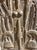 This vintage Dogon granary door from Mali showcases exceptional carved relief artistry, featuring four standing chiwaras...