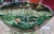Spectacular Mid-Century Murano art glass folded bowl in emerald green with abundant copper aventurine flecks. This large...