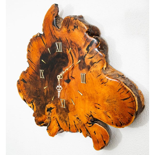 Beautiful burl wall clock. American made. This piece is battery powered and is untested. Unique and well made piece ready...