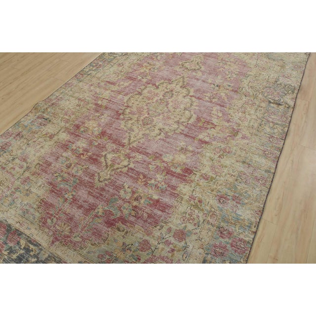 An authentic vintage traditional Tabriz rug hand-knotted with fine wool and natural dyes. This oriental rug features a...