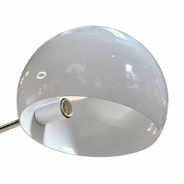 The David Weeks Boi Tiered Pendant Light is a dramatic sculptural chandelier defined by its branching, multi-level...